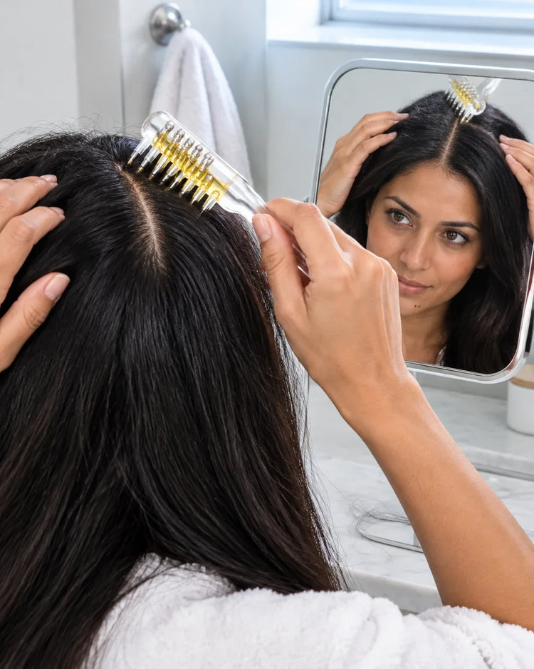 A portrait photograph cropped from the recurring 38-year-old Pakistani woman's shoulders to crown, d